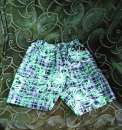 Новые мужские короткие шорты в чёрно-белую клетку с зелёным орнаментом. Одежда - Покупка/Продажа